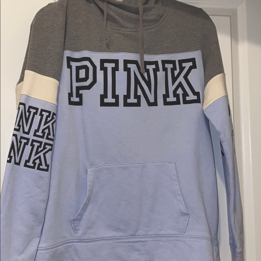 Gray and purple sweater.